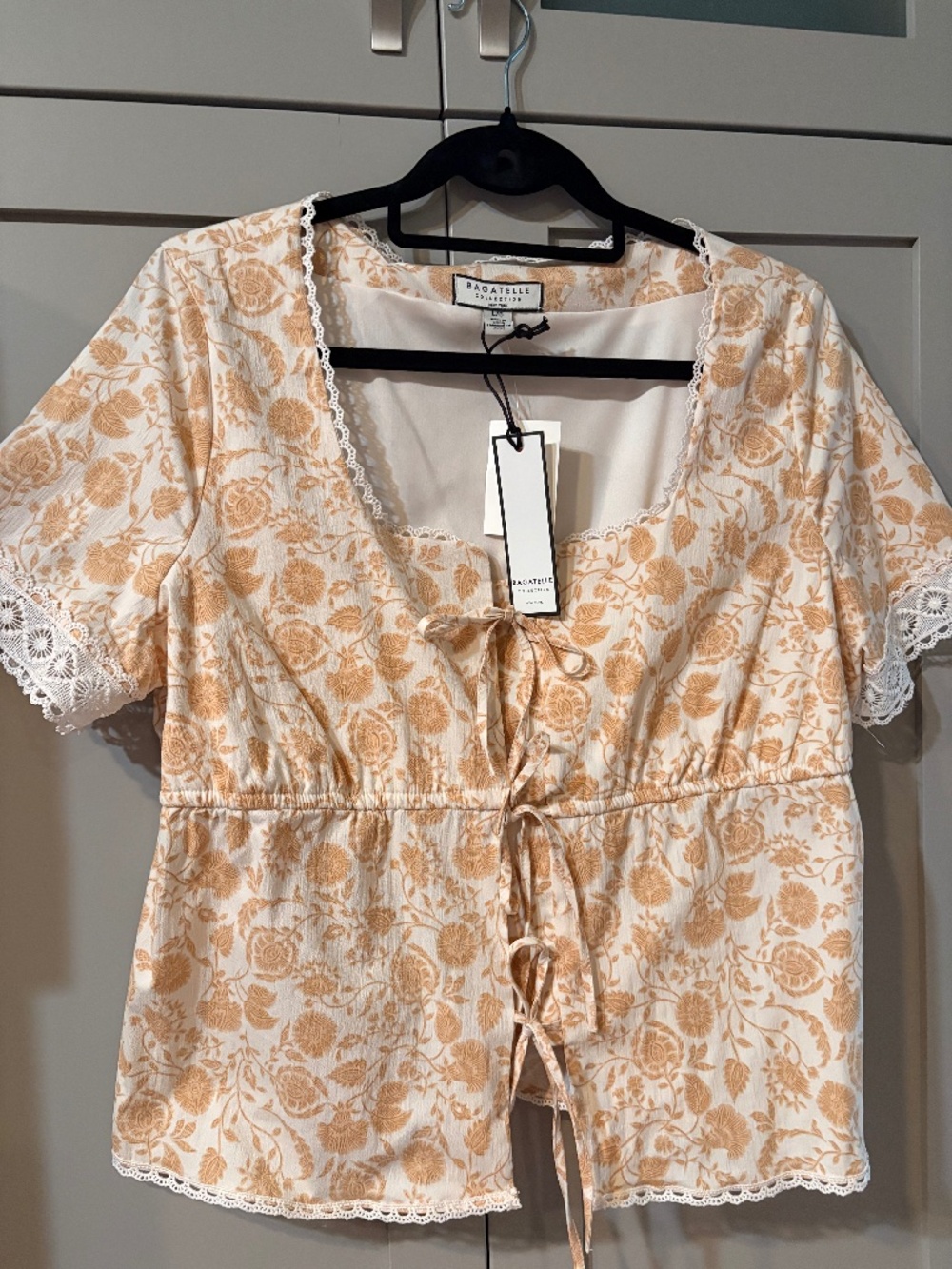 NWT - Bagatelle Top with front bow ties and lace details. Size Large